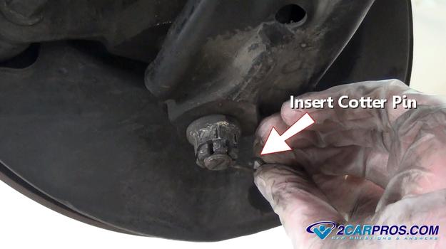 insert lower ball joint cotter pin
