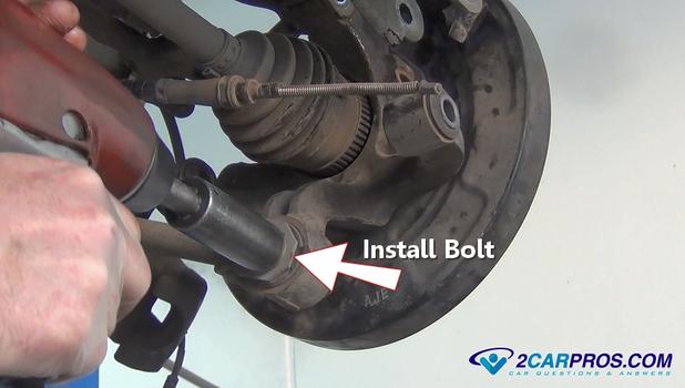 install lower swing arm bolt