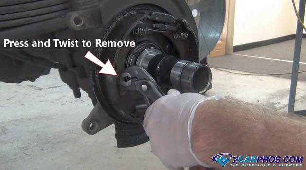 remove parking brake retainer