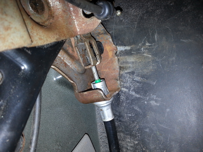 The Retaining Tabs on the Parking Brake Cable (where It Connects