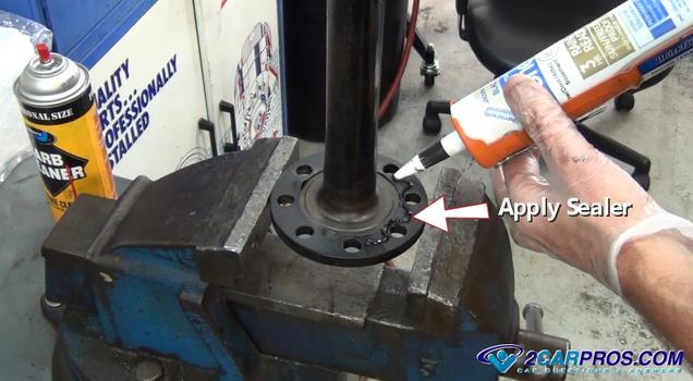 apply-sealer-to-axle-flange