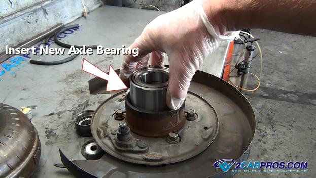 insert new rear axle bearing