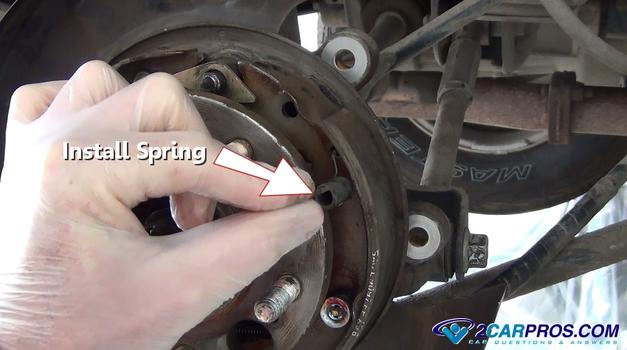 install parking brake upper return spring