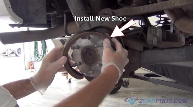 install new parking brake shoe