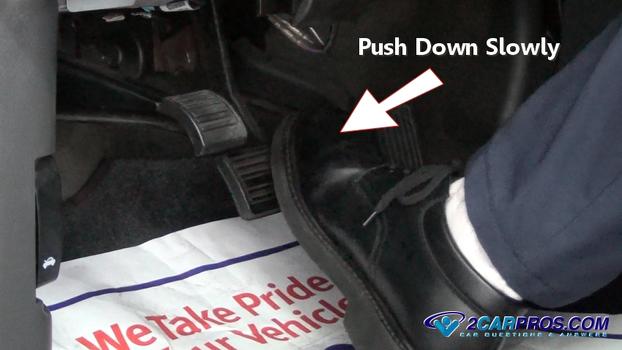 push down brake pedal slowly