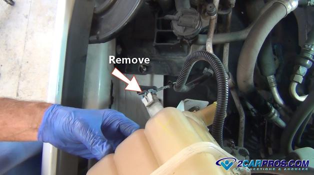 remove coolant reservoir connector
