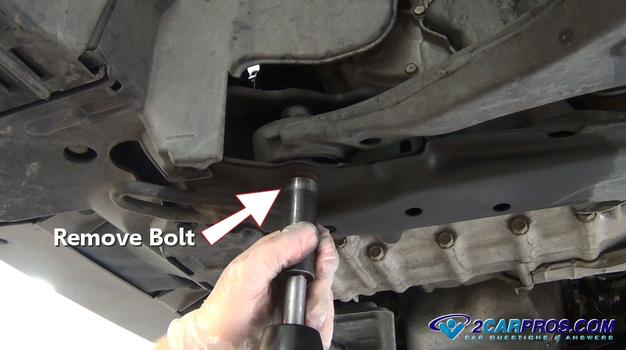 remove lower control arm mounting bolt