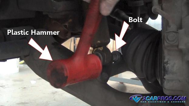 remove lower shock mount bolt hammer