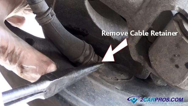remove parking brake cable retainer
