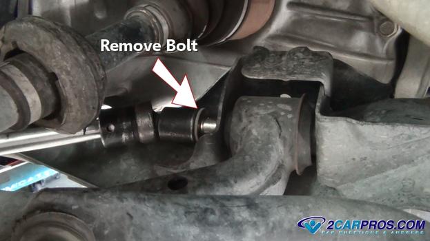 remove rear lower control arm mounting bolt