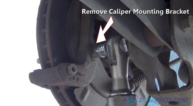 remove caliper bracket bolts