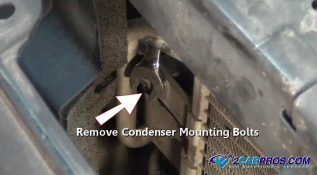 remove condenser mounting bolts