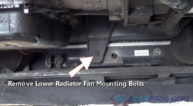 remove lower radiator fan mounting bolts