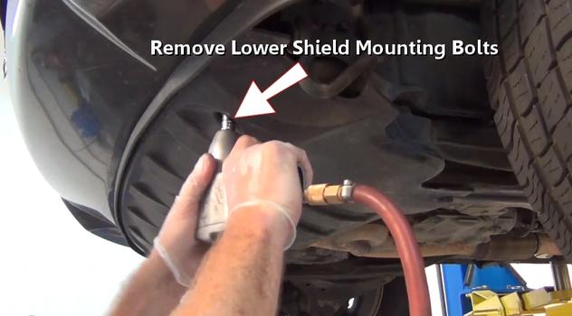 remove lower shield mounting bolts