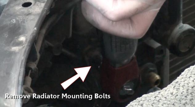 remove radiator mounting bolts