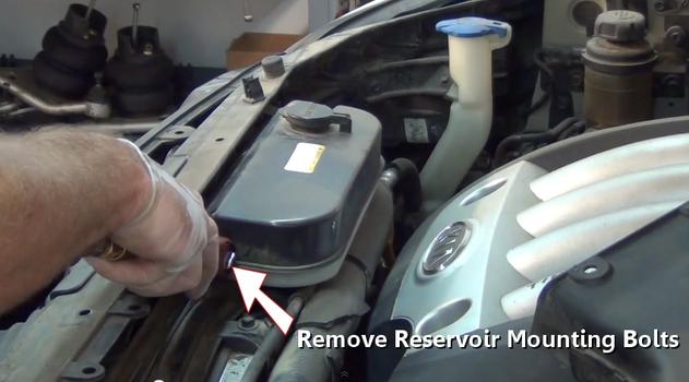 remove reservoir mounting bolts
