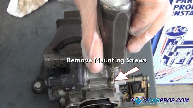 removing idle control valve mounting screws