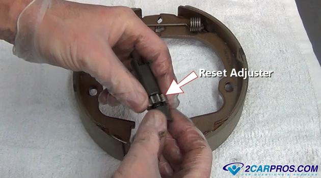 reset parking brake shoe self adjuster