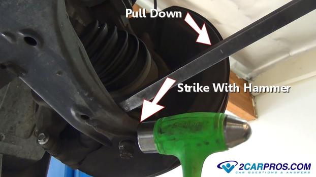 strike lower ball joint with hammer