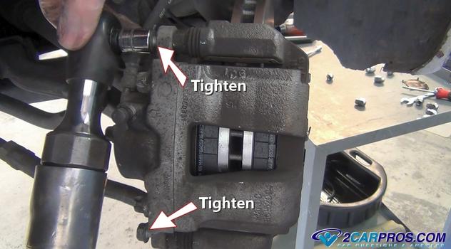 tighten caliper mounting bolts