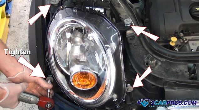 tighten headlight lens mounting bolts