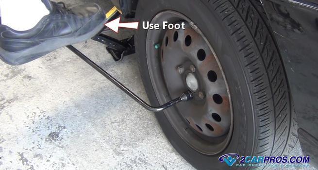 use foot to remove lugs